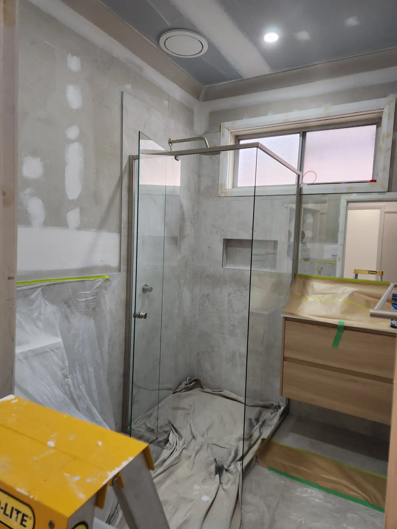 Bathroom masked and protected before painting