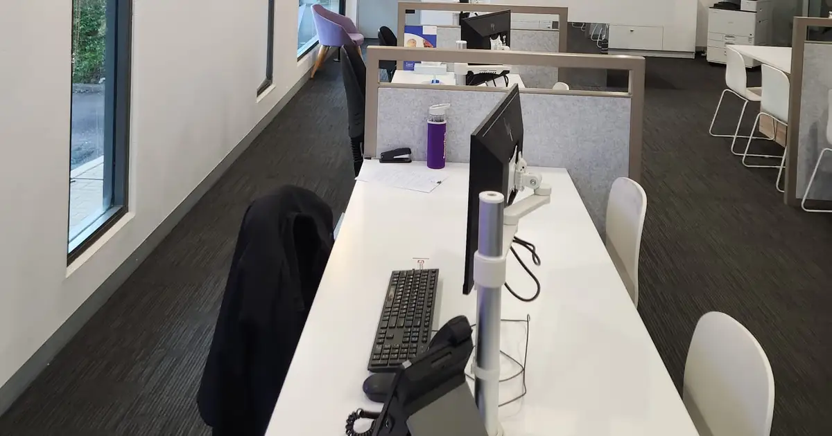 Newcastle bank branch interior repainted with workstations protected
