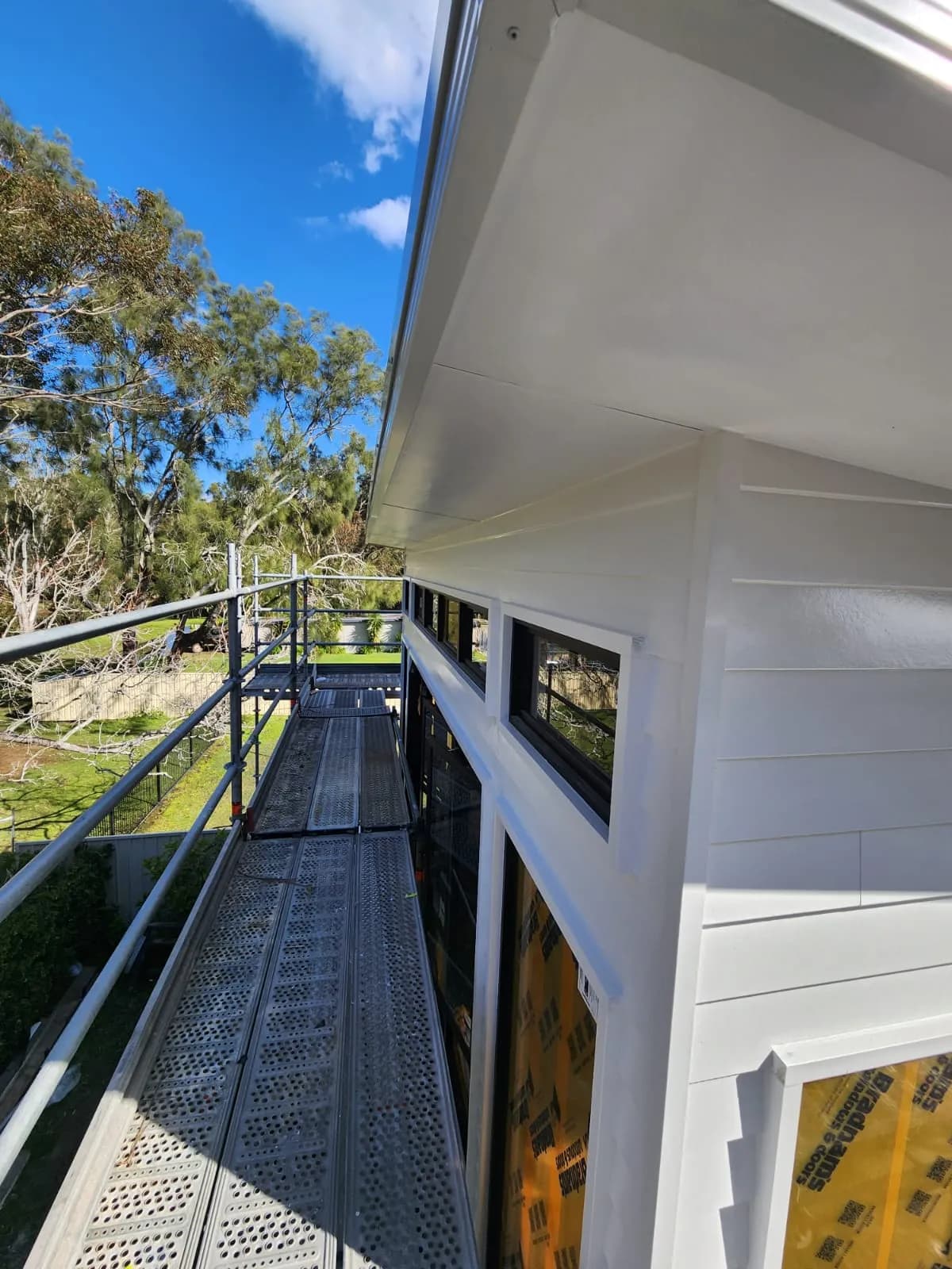 Completed exterior paintwork viewed from scaffolding on a coastal Newcastle home