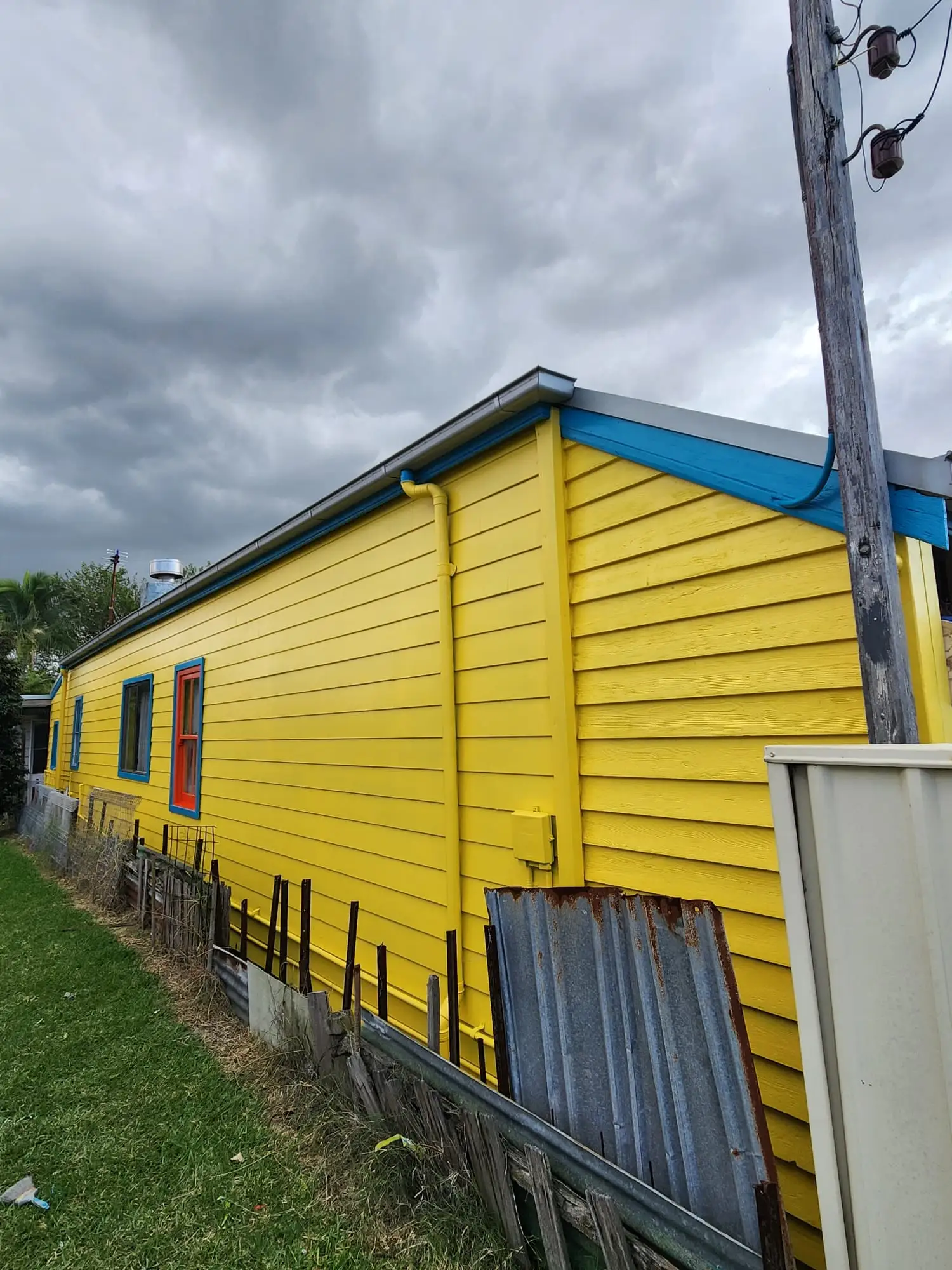 Yellow weatherboard exterior repaint in Newcastle