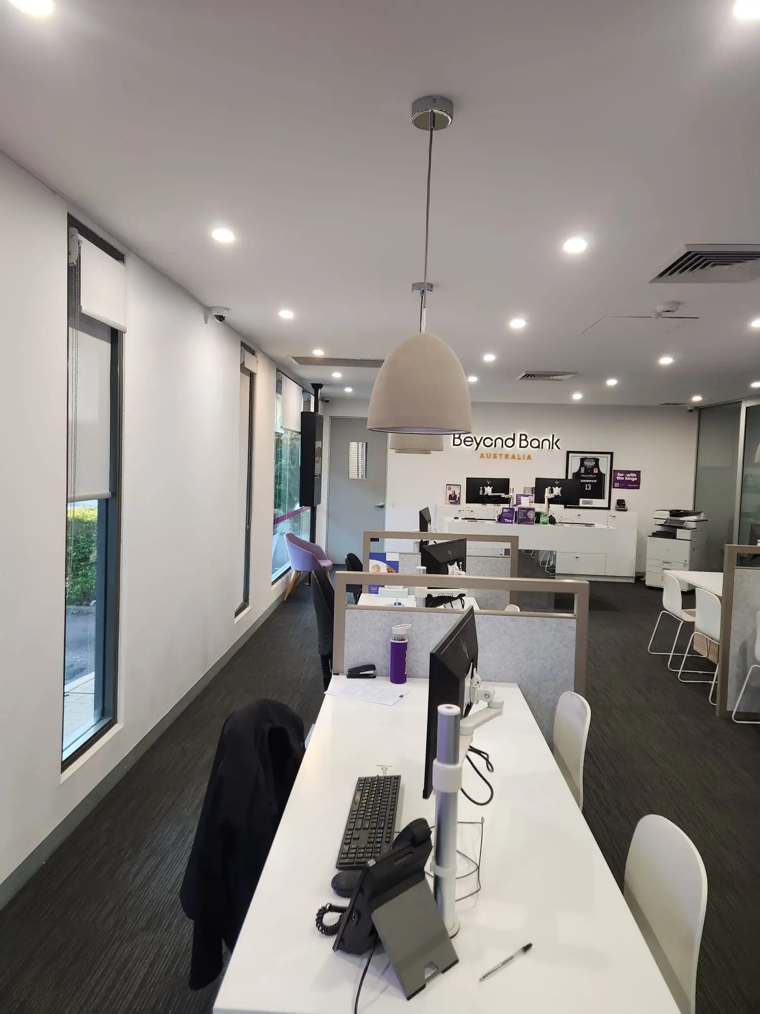 Newcastle bank branch interior repainted with workstations protected